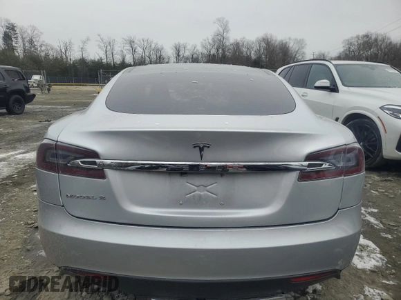 2013 Tesla Model S with VIN 5YJSA1AC9DFP10705, listed as a Copart auction lot 89394665 with Not Provided miles and Salvage Title. Bid and sale history available at carsss.com. Image 6.