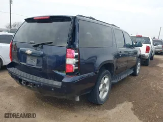 2009 Chevrolet Suburban LT w/2LT with VIN 1GNFC26JX9R280829, listed as a IAAI auction lot 41551580 with 214,351 mi miles. Bid and sale history available at carsss.com. Image 4.