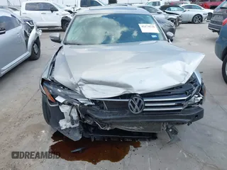 2013 Volkswagen Passat SE z VIN 1VWBP7A30DC144719, wystawiony jako IAAI lot #42174524 z przebiegiem 181 326 mil mil oraz . Historia ofert i sprzedaży dostępna na DreamBid. Obrazek 6.