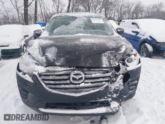 2016 Mazda CX-5 Sport z VIN JM3KE4BY0G0919017, wystawiony jako IAAI lot #41316161 z przebiegiem 209 259 mil mil oraz . Historia ofert i sprzedaży dostępna na DreamBid. Obrazek 12.