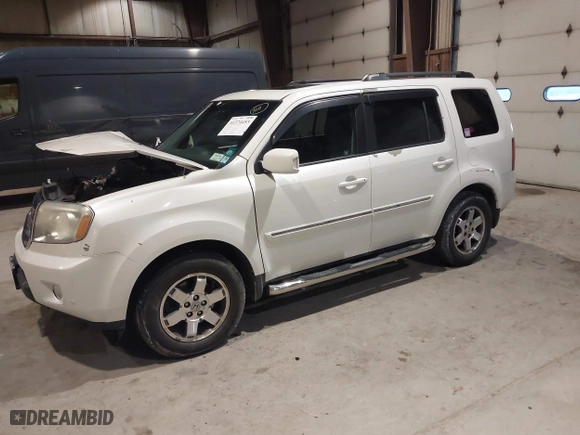 2011 Honda Pilot Touring with VIN 5FNYF4H93BB084167, listed as a IAAI auction lot 41374453 with 151,014 mi miles. Bid and sale history available at carsss.com. Image 17.