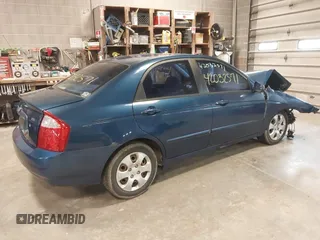 2004 Kia Spectra LX with VIN KNAFE121145012249, listed as a IAAI auction lot 42032571 with 146,748 mi miles. Bid and sale history available at carsss.com. Image 4.