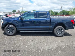2023 Ford F-150 Lightning Pro с VIN 1FT6W1EVXPWG42428, выставлен на аукционе IAAI как лот 39711091 с пробегом 6 308 миль миль и . История ставок и продаж доступна на DreamBid. Изображение 14.