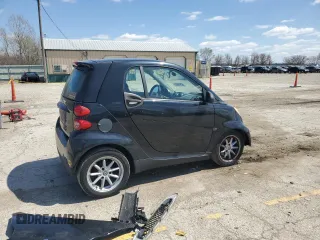 2009 Smart fortwo Pure z VIN WMEEJ31X49K219479, wystawiony jako Copart lot #52446625 z przebiegiem 82 337 mil mil oraz Szkody całkowita. Historia ofert i sprzedaży dostępna na DreamBid. Obrazek 3.