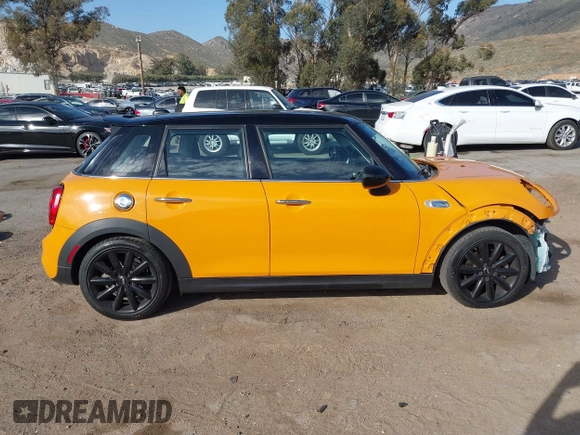 2015 MINI Hardtop 4 Door S z VIN WMWXU3C51F2B57061, wystawiony jako IAAI lot #41691431 z przebiegiem 66 406 mil mil oraz . Historia ofert i sprzedaży dostępna na DreamBid. Obrazek 14.