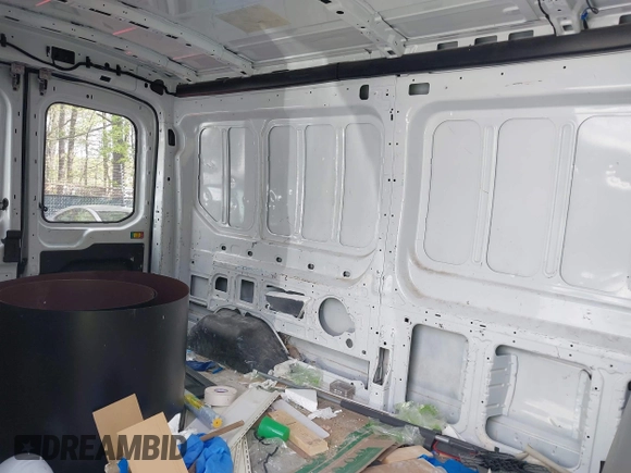 2021 Ford Transit Cargo with VIN 1FTBR1C85MKA48173, listed as a IAAI auction lot 42005472 with 81,980 mi miles and . Bid and sale history available at DreamBid. Image 8.