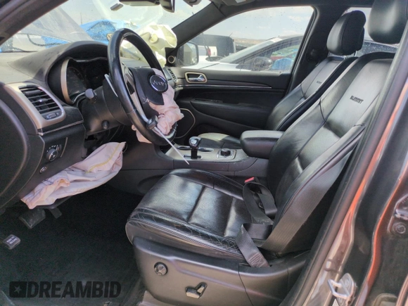 2014 Jeep Grand Cherokee Summit with VIN 1C4RJFJM8EC395169, listed as a Copart auction lot 60637265 with 116,575 mi miles and Salvage title. Bid and sale history available at DreamBid. Image 7.