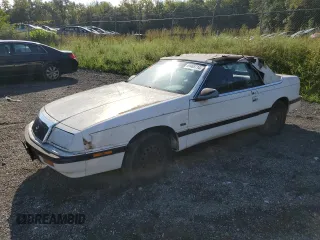 1992 Chrysler LeBaron z VIN 1C3XU553XNF239048, wystawiony jako Copart lot #69465714 z przebiegiem Nie podano mil oraz Tytuł czysty. Historia ofert i sprzedaży dostępna na DreamBid. Obrazek 1.