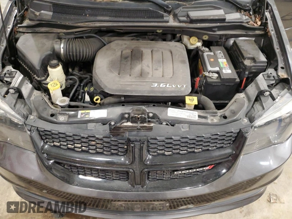 2015 Dodge Grand Caravan SE with VIN 2C4RDGBG6FR668740, listed as a Copart auction lot 50211885 with 129,695 mi miles and Salvage Title. Bid and sale history available at DreamBid. Image 12.