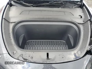 2024 Tesla Model Y z VIN 7SAYGDED1RF089192, wystawiony jako Copart lot #48752085 z przebiegiem 7 643 mil mil oraz Szkoda całkowita • Salvage title. Historia ofert i sprzedaży dostępna na DreamBid. Obrazek 13.