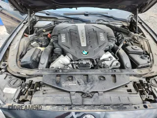2013 BMW 5 Series 550i xDrive with VIN WBAFU9C55DDY72065, listed as a Copart auction lot 63023675 with 117,592 mi miles and Salvage title. Bid and sale history available at DreamBid. Image 11.