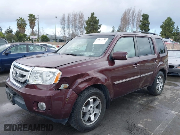 2009 Honda Pilot Touring with VIN 5FNYF48959B007813, listed as a IAAI auction lot 41823645 with 200,571 mi miles and . Bid and sale history available at carsss.com. Image 6.