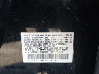2013 Honda Pilot Touring with VIN 5FNYF4H9XDB047796, listed as a IAAI auction lot 41591189 with 188,579 mi miles and . Bid and sale history available at carsss.com. Image 9.
