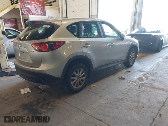 2016 Mazda CX-5 Sport with VIN JM3KE2BE5G0720507, listed as a IAAI auction lot 41872003 with 160,727 mi miles and . Bid and sale history available at carsss.com. Image 4.
