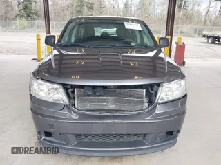 2015 Dodge Journey SE z VIN 3C4PDCAB1FT617794, wystawiony jako IAAI lot #41922371 z przebiegiem 130 558 mil mil oraz . Historia ofert i sprzedaży dostępna na DreamBid. Obrazek 13.
