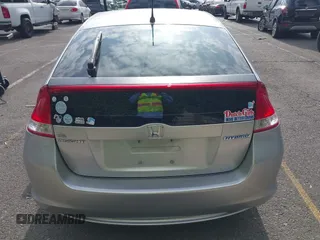 2010 Honda Insight EX with VIN JHMZE2H75AS003695, listed as a IAAI auction lot 42119429 with 90,901 mi miles and . Bid and sale history available at DreamBid. Image 16.