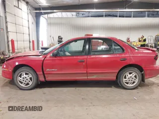1999 Pontiac Sunfire SE z VIN 1G2JB524XX7547651, wystawiony jako IAAI lot #41962158 z przebiegiem 130 385 mil mil oraz . Historia ofert i sprzedaży dostępna na DreamBid. Obrazek 14.