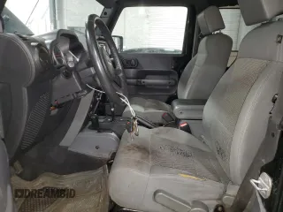2009 Jeep Wrangler Rubicon with VIN 1J4GA64159L770895, listed as a Copart auction lot 82140864 with 209,464 mi miles and Salvage Title. Bid and sale history available at DreamBid. Image 7.