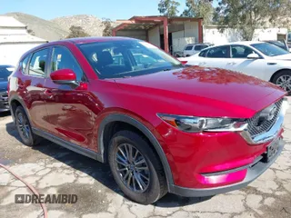 2019 Mazda CX-5 Sport with VIN JM3KFABM0K1633065, listed as a IAAI auction lot 41968786 with 90,407 mi miles and . Bid and sale history available at DreamBid. Image 1.