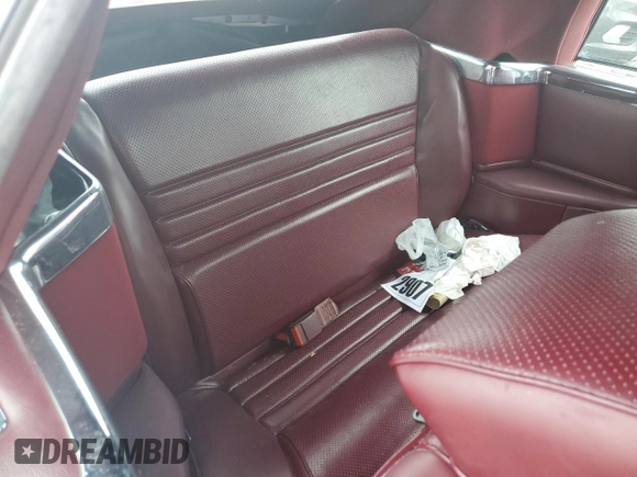 1989 Chrysler LeBaron z VIN 1C3XJ45J8KG223051, wystawiony jako Copart lot #75115464 z przebiegiem 27 923 mil mil oraz Szkody całkowita. Historia ofert i sprzedaży dostępna na DreamBid. Obrazek 10.