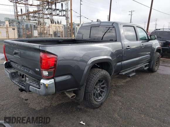 2022 Toyota Tacoma SR5 with VIN 3TMBZ5DN2NM034561, listed as a IAAI auction lot 40867443 with 51,728 mi miles and . Bid and sale history available at DreamBid. Image 4.