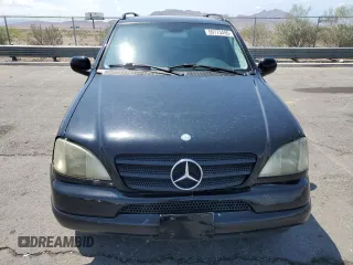 2001 Mercedes-Benz M 320/430/500 with VIN 4JGAB54EX1A241105, listed as a Copart auction lot 59773455 with 242,944 mi miles and Salvage title. Bid and sale history available at DreamBid. Image 5.