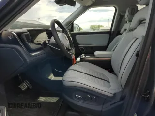 2023 Rivian R1S Adventure z VIN 7PDSGABA5PN010593, wystawiony jako Copart lot #52508835 z przebiegiem 16 962 mil mil oraz Szkody całkowita. Historia ofert i sprzedaży dostępna na DreamBid. Obrazek 7.