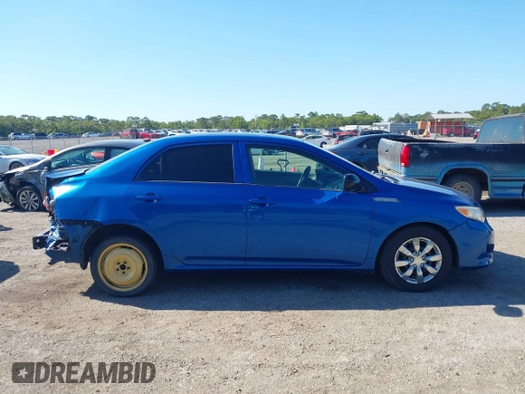 2009 Toyota Corolla with VIN JTDBL40E999021523, listed as a IAAI auction lot 42019856 with 194,011 mi miles. Bid and sale history available at carsss.com. Image 14.