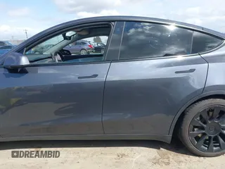 2022 Tesla Model Y Long Range with VIN 7SAYGAEE6NF341827, listed as a IAAI auction lot 41946388 with Not Provided miles and . Bid and sale history available at DreamBid. Image 13.