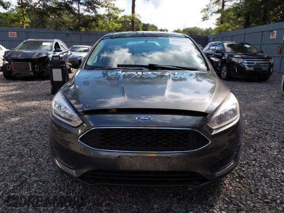 2018 Ford Focus SE z VIN 1FADP3FE0JL284107, wystawiony jako IAAI lot #42815845 z przebiegiem 110 155 mil mil oraz . Historia ofert i sprzedaży dostępna na DreamBid. Obrazek 12.