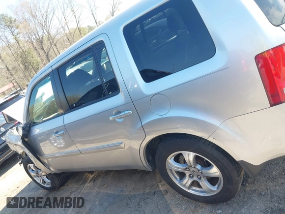 2013 Honda Pilot EX-L with VIN 5FNYF3H59DB022797, listed as a IAAI auction lot 41880675 with 206,359 mi miles and . Bid and sale history available at DreamBid. Image 14.