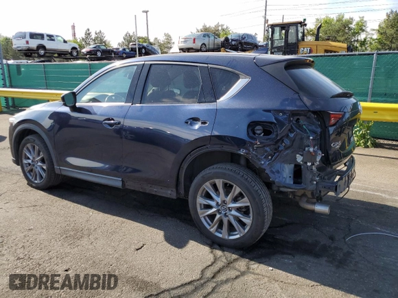2021 Mazda CX-5 Grand Touring with VIN JM3KFBDM3M1344784, listed as a Copart auction lot 58051445 with 69,593 mi miles and Salvage title. Bid and sale history available at DreamBid. Image 2.
