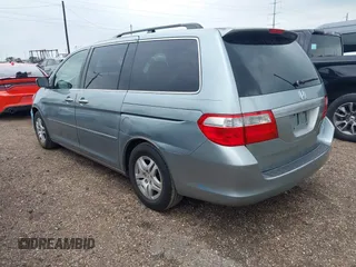 2005 Honda Odyssey EX with VIN 5FNRL38415B104920, listed as a IAAI auction lot 42094690 with 228,538 mi miles. Bid and sale history available at carsss.com. Image 3.