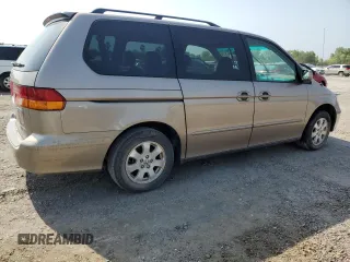 2004 Honda Odyssey EX-L with VIN 5FNRL18934B107378, listed as a Copart auction lot 51972795 with 186,043 mi miles and Salvage Title. Bid and sale history available at DreamBid. Image 3.