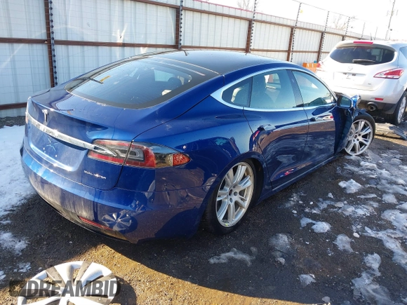 2020 Tesla Model S Long Range with VIN 5YJSA1E26LF410779, listed as a IAAI auction lot 41241192 with 68,764 mi miles and . Bid and sale history available at DreamBid. Image 4.