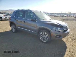 2014 Volkswagen Tiguan SEL with VIN WVGAV3AX0EW555873, listed as a Copart auction lot 55695955 with 69,984 mi miles and Salvage title. Bid and sale history available at DreamBid. Image 4.
