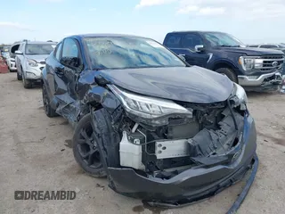 2021 Toyota C-HR LE with VIN JTNKHMBX9M1118773, listed as a IAAI auction lot 41115157 with 57,289 mi miles. Bid and sale history available at carsss.com. Image 1.