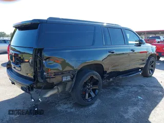 2019 Chevrolet Suburban Premier with VIN 1GNSKJKJ1KR100936, listed as a IAAI auction lot 40489121 with 97,884 mi miles and . Bid and sale history available at DreamBid. Image 4.