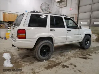 1997 Jeep Grand Cherokee Limited with VIN 1J4GZ78Y5VC747553, listed as a Copart auction lot 49125085 with 0 mi miles and Salvage Title. Bid and sale history available at carsss.com. Image 3.