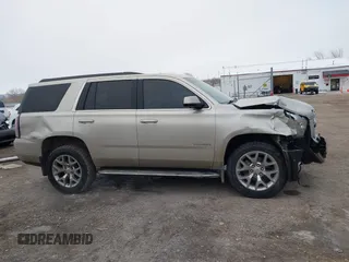 2015 GMC Yukon SLT z VIN 1GKS2BKC6FR655777, wystawiony jako IAAI lot #40982330 z przebiegiem 120 627 mil mil oraz . Historia ofert i sprzedaży dostępna na DreamBid. Obrazek 14.
