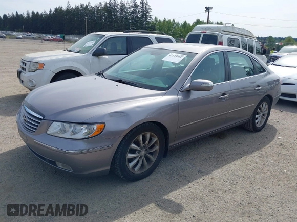 2007 Hyundai Azera SE z VIN KMHFC46F57A141280, wystawiony jako IAAI lot #42214462 z przebiegiem 105 476 mil mil oraz . Historia ofert i sprzedaży dostępna na DreamBid. Obrazek 2.