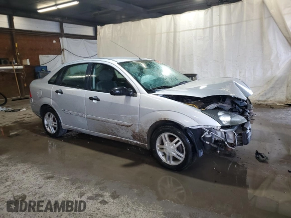 2003 Ford Focus SE z VIN 1FAFP34P43W186633, wystawiony jako Copart lot #56899065 z przebiegiem Nie podano mil oraz Szkoda całkowita • Salvage title. Historia ofert i sprzedaży dostępna na DreamBid. Obrazek 4.