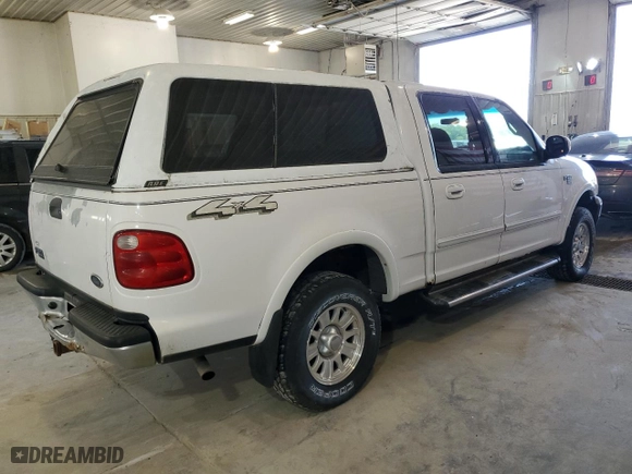 2001 Ford F-150 SuperCrew XLT with VIN 1FTRW08L21KE03150, listed as a Copart auction lot 67372004 with 184,124 mi miles and Salvage Title. Bid and sale history available at carsss.com. Image 3.