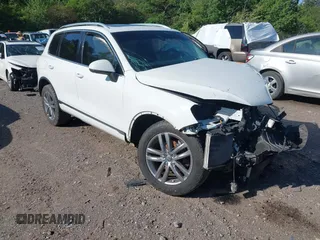 2016 Volkswagen Touareg Sport with VIN WVGEP9BP4GD002364, listed as a IAAI auction lot 42113909 with Not provided miles and . Bid and sale history available at DreamBid. Image 1.