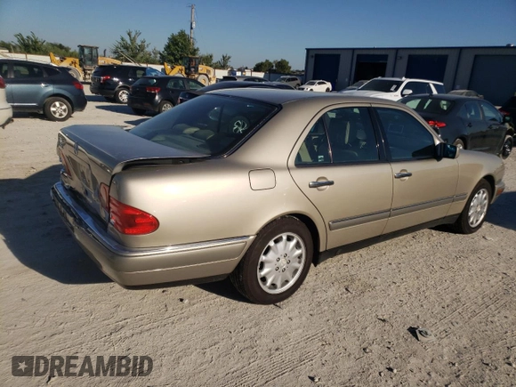 1996 Mercedes-Benz E-Class with VIN WDBJF55F7TJ022765, listed as a Copart auction lot 70577504 with 186,340 mi miles and Salvage Title. Bid and sale history available at carsss.com. Image 3.