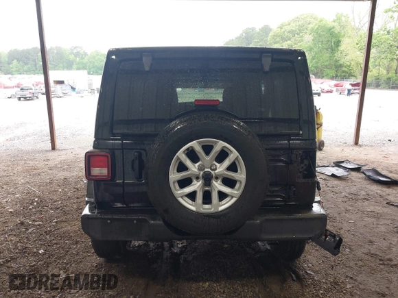 2023 Jeep Wrangler Willys with VIN 1C4HJXDG0PW617101, listed as a IAAI auction lot 42111687 with 56,415 mi miles and . Bid and sale history available at DreamBid. Image 17.