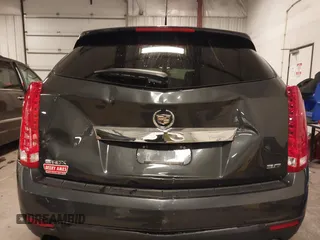 2014 Cadillac SRX with VIN 3GYFNAE34ES665630, listed as a IAAI auction lot 41315281 with 99,009 mi miles and . Bid and sale history available at DreamBid. Image 6.