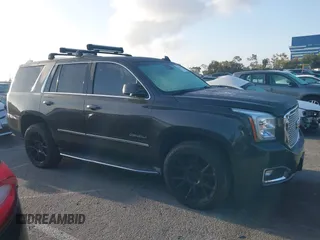 2015 GMC Yukon Denali z VIN 1GKS1CKJ7FR566419, wystawiony jako IAAI lot #41948825 z przebiegiem 235 037 mil mil oraz . Historia ofert i sprzedaży dostępna na DreamBid. Obrazek 13.