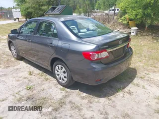 2011 Toyota Corolla L with VIN 2T1BU4EE0BC680158, listed as a IAAI auction lot 42060987 with 131,669 mi miles. Bid and sale history available at carsss.com. Image 3.