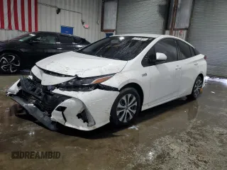 2021 Toyota Prius LE z VIN JTDKAMFP3M3176000, wystawiony jako Copart lot #59836145 z przebiegiem 75 196 mil mil oraz Czysty tytuł • Clean title. Historia ofert i sprzedaży dostępna na DreamBid. Obrazek 1.